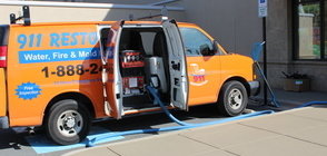 Water Damage Herber Restoration Van At Exterior Of Job Location