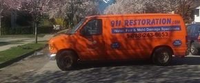 Water Damage Restoration Van At Residential Job Site