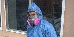 Water Damage Restoration Technician Suited Up